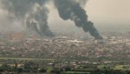 This image grab taken from AFPTV video footage on April 28, 2023, shows an aerial view of black smoke rising over Khartoum. (Photo by AFPTV / AFP)
