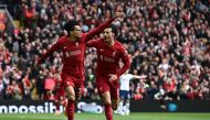 Liverpool's Colombian midfielder Luis Diaz (L) celebrates with Liverpool's English midfielder Curtis Jones (R) after scoring their second goal during the English Premier League football match between Liverpool and Tottenham Hotspur at Anfield in Liverpool, north west England on April 30, 2023. (Photo by Paul ELLIS / AFP)
