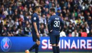 Paris Saint-Germain's Moroccan defender Achraf Hakimi (L) reacts next to Paris Saint-Germain's Argentine forward Lionel Messi (R) after receiving a second yellow card resulting in his being sent off during the French L1 football match between Paris Saint-Germain (PSG) and FC Lorient at The Parc des Princes Stadium in Paris on April 30, 2023. (Photo by FRANCK FIFE / AFP)