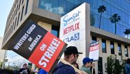 Writers picket in front of Netflix on Sunset Boulevard in Hollywood, California, on May 2, 2023 as the Writers Guild of American (WGA) goes on strike. Photo by Frederic J. BROWN / AFP