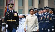 Philippines President Ferdinand Marcos, accompagned by Army colonel David Rowland, reviews the troops during a welcome ceremony outside of the Pentagon in Washington, DC on May 3, 2023. Photo by Mandel NGAN / AFP
