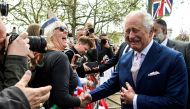 Britain's King Charles III meets members of the public gather on The Mall, near Buckingham Palace in central London, on May 5, 2023, ahead of the coronation weekend. (Photo by TOBY MELVILLE / POOL / AFP)