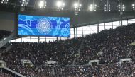 A screen shows a message for the coronation of King Charles III prior to the start of the English Premier League football match between Tottenham Hotspur and Crystal Palace at Tottenham Hotspur Stadium in London, on May 6, 2023. (Photo by ISABEL INFANTES / AFP) 