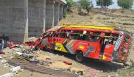 Onlookers gather at the site of a bus accident in Khargone district of India's Madhya Pradesh state on May 9, 2023. Photo by AFP