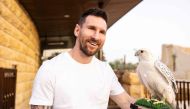 (Files) This file handout photo taken on May 01, 2023, and provided by the Saudi Tourism Authority shows Argentina's forward Lionel Messi holding a falcon in Riyadh. (Photo by Saudi Tourism Authority / AFP) 