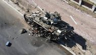 File Photo: A charred Russian tank is seen on the front line in the Kyiv region, Ukraine March 20, 2022. (Ukrainian Ground Forces/via REUTERS)