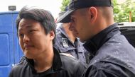 :South Korean cryptocurrency entrepreneur, co-founder of Terraform Labs (Terra Luna), Do Kwon (L), is taken to court in Podgorica on May 11, 2023, following his arrest on March 24 at the Montenegrin capital's international airport. (Photo by SAVO PRELEVIC / AFP)
