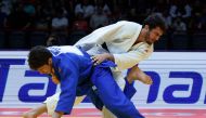 Georgia’s Luka Maisuradze and Lasha Bekauri (white) compete in the men’s -90kg final bout. Picture: AFP