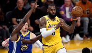 LeBron James #6 of the Los Angeles Lakers is defended by Draymond Green #23 of the Golden State Warriors during the first half of the Western Conference Semifinal Playoffs at Crypto.com Arena on May 12, 2023 in Los Angeles, California. Kevork Djansezian/Getty Images/AFP