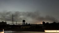 Smoke billows in Khartoum amid ongoing fighting between the forces of two rival generals, on May 11, 2023. (Photo by AFP)