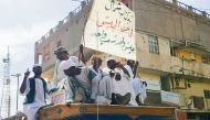 People form a convoy as they celebrate in support of the Sudanese armed forces in Khartoum on May 12, 2023, as violence between the forces of two rival Sudanese generals continues. (Photo by AFP)