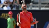 Serbia's Novak Djokovic reacts during his third round match against Bulgaria's Grigor Dimitrov at the Men's ATP Rome Open tennis tournament at Foro Italico in Rome on May 14, 2023. (Photo by Tiziana FABI / AFP)