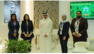 Officials at the Doha Bank stand at Build Your House Exhibition 2023.