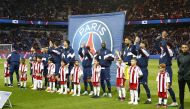 PSG football players with children at the Parc des Princes stadium