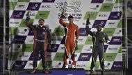 The 2023 Qatar Karting Championship winner Bader Al Sulaiti celebrates on the podium along with Faesal Al Yafei and Omar Aswat.  
Final 