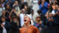 Denmark's Holger Rune celebrates after defeating Norway's Casper Ruud during their semifinals match of the Men's ATP Rome Open tennis tournament at Foro Italico in Rome on May 20, 2023. (Photo by Filippo MONTEFORTE / AFP)

