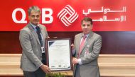 Mohammad Jamil Ahmad Hamad, Chief Risk Officer at QIIB receiving the certificate by Ramakrishnan Balagopal, SISA Vice President.