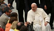 Pope Francis meets with pilgrims from the diocese of Spoleto-Norcia, on May 20, 2023 during an audience at Paul-VI hall in The Vatican. (Photo by Tiziana Fabi / AFP)