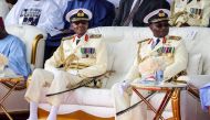 Outgoing Nigerian President Muhammadu Buhari (left) looks on with the Chief of Naval Staff, Vice Admiral Awwal Zubairu Gambo at the presidential fleet review held at the Naval Dockyard in Lagos on May 22, 2023. (Photo by Samuel Alabi / AFP)