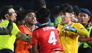 File photo of Indonesia's Komang Teguh Trisnanda (C) and Thailand's Soponwit Rakyart (R) react as a fight breaks out on the sidelines of the men's football final match between Thailand and Indonesia during the 32nd Southeast Asian Games (SEA Games) in Phnom Penh on May 16, 2023. (Photo by Nhac NGUYEN / AFP)