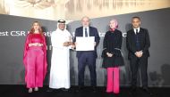 Carrefour Regional Director Laurent Hausknecht receiving CSR Award Certificate from Dr. Saif Ali Al Hajri.
