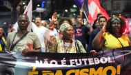 People take part in a demonstration in support of Real Madrid's Brazilian forward Vinicius Jr in Rio de Janeiro, Brazil, on May 25, 2023. (Photo by Bruno Kaiuca / AFP)