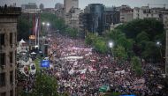 Supporters of Serbian president take part in a pro-government rally in Belgrade, on May 26, 2023. (Photo by Oliver Bunic / AFP)