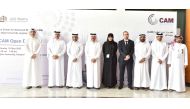 QU President Dr. Hassan Al Derham (third left); Vice-President for Research and Graduate Studies Prof. Mariam Al Maadeed (centre); and other officials at QU-CAM open day activities.