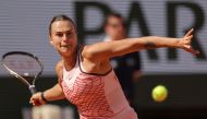 Belarus' Aryna Sabalenka plays a forehand return to Ukraine's Marta Kostyuk during their women's singles match on day one of the Roland-Garros Open tennis tournament at the Court Philippe-Chatrier in Paris on May 28, 2023. Photo by Thomas SAMSON / AFP