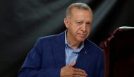Turkey's President and presidential candidate of AK Party Recep Tayyip Erdogan gestures at the polling station on the day of the Presidential runoff vote in Istanbul on May 28, 2023. (Photo by MURAD SEZER / POOL / AFP)