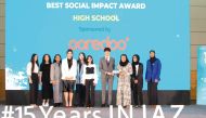 Ooredoo’s Director CSR, Sponsorship and Media, Moza Khalid Al Muhannadi (third right) with winning student teams at the awards ceremony.  