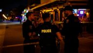 MAY 29: Law enforcement officers are seen on a crime scene as they respond to a shooting at Hollywood Beach on May 29, 2023 in Hollywood, Florida. Photo by Eva Marie Uzcategui / Getty Images North America / Getty Images via AFP