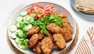 Lightly spiced and served with crunchy vegetables and fresh herbs, kotlet are great for road trips and picnics. Rey Lopez/The Washington Post 
