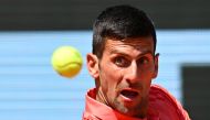 Serbia's Novak Djokovic eyes the ball as he plays against Peru's Juan Pablo Varillas during their men's singles match on day eight of the Roland-Garros Open tennis tournament at the Court Philippe-Chatrier in Paris on June 4, 2023. Photo by Emmanuel DUNAND / AFP