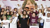 Delfina Gomez (C), candidate for governor for the State of Mexico for a coalition led by the ruling Morena political party, unofficially celebrates being elected governor of the State of Mexico in Toluca, Mexico State, on June 24, 2023. (Photo by CLAUDIO CRUZ / AFP)

