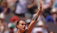 Belarus' Aryna Sabalenka celebrates winning against Ukraine's Elina Svitolina during their women's singles quarter final match on day ten of the Roland-Garros Open tennis tournament at the Court Philippe-Chatrier in Paris on June 6, 2023. (Photo by Thomas SAMSON / AFP)