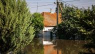 A house in a flooded area of the town of Kherson following damages sustained at Kakhovka HPP dam, amid the Russian invasion of Ukraine. (Photo by STRINGER / AFP)