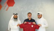 Anthony Hudson with Al Markhiya officials.