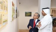 Katara Deputy Director-General of the Foundation and Director of the Human Resources Department, Saif Al Dosari and Peru Ambassador to Qatar H E Jose Benzaquin Perea touring the exhibition.