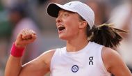 Poland's Iga Swiatek celebrates after winning against Brazil's Beatriz Haddad Maia at the end of their women's singles semi-final match on day twelve of the Roland-Garros Open tennis tournament at the Court Philippe-Chatrier in Paris on June 8, 2023. Photo by Thomas SAMSON / AFP