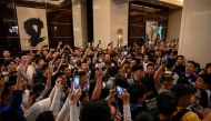 Chinese fans wait for members of Argentina's football team in the lobby of a hotel where the team is staying in Beijing on June 10, 2023. (Photo by Jade Gao / AFP)