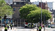 A police officer stands by a cordon outside the Theatre Royal on Upper Parliament Street in Nottingham, central England. (Photo by Darren Staples / AFP)