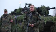 (FILES) German Defence Minister Boris Pistorius stands in front of a Puma tank as he addresses troops of the German armed forces Bundeswehr at a military training area in Altengrabow near Moeckern, eastern Germany, on January 26, 2023. (HARTMANN / AFP)

