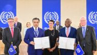 Minister of Labour and President of the International Labour Conference H E Dr. Ali bin Smaikh Al Marri (second left) and Director-General of the International Labour Organisation H E Gilbert Houngbo (second right) during the signing of memorandum of adoption.