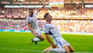 Scotland's midfielder John McGinn (L) and Scotland's midfielder Kenny McLean celebrate after their team scored during the UEFA Euro 2024 group A qualification football match between Norway and Scotland in Oslo on June 17, 2023. (Photo by Fredrik Varfjell / NTB / AFP)