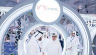 Minister of State and President of Qatar National Library H E Hamad bin Abdulaziz Al Kawari  (second right) visits the NHRC stand at the DIBF.