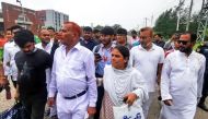 Shahjahan Bhuiyan (second left) walks out from jail after his release in Keraniganj on June 18, 2023. (Photo by AFP)