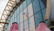 Attendees wearing traditional dress arrive at the Grand Palais Ephemere for the Riyadh 2030 reception event to promote Riyahd's candidacy for 2030 World Expo, in Paris on June 19, 2023. (Photo by Ludovic MARIN / AFP)