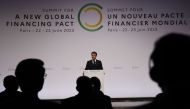 French President Emmanuel Macron delivers a speech during the opening session of the New Global Financial Pact Summit at the Palais Brogniart in Paris on June 22, 2023. (Photo by LUDOVIC MARIN / POOL / AFP)