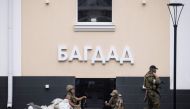 Members of Wagner group stand guard in Rostov-on-Don, on June 24, 2023. (Photo by Roman ROMOKHOV / AFP) 